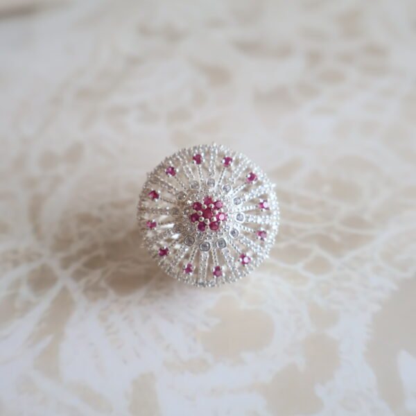 92.5 silver Rakhri crafted with sparkling American diamonds — a graceful forehead ornament for traditional occasions.