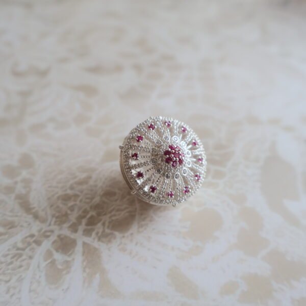 92.5 silver Rakhri crafted with sparkling American diamonds — a graceful forehead ornament for traditional occasions.