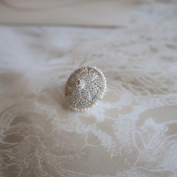 92.5 silver Rakhri crafted with sparkling American diamonds — a graceful forehead ornament for traditional occasions.