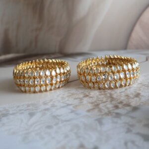Ponchi bangles with monzonite polkies and gold polish – traditional Indian jewellery design